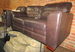 A two seater brown leather sofa, together with a matching armchair. The upholstery in this lot does