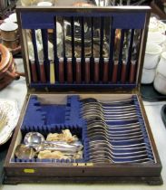 An oak cased canteen containing cutlery.