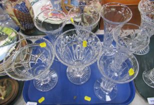 A group of cut glass vases.