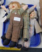 Four Gloobee porcelain headed dolls.