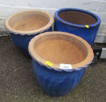 Three blue glazed plant pots.