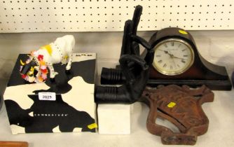 A Cow Parade figure, Rock and Roll Cow, boxed, together with two bookends modelled as hands, a Londo
