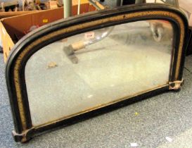 A Victorian over mantel mirror, of arched form with ebonised surround, 73cm wide.