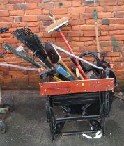 Assorted work and garden tools, to include workbench, brushes, rakes, spades, saws, etc. (a quantity