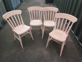 A set of four beech kitchen chairs. With the option of the next lot at the same price.