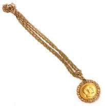 An Edward VII full gold sovereign pendant, dated 1909 in a yellow metal mount stamped 9ct, on fancy