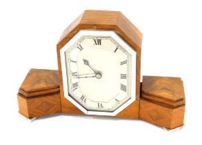 An unusual walnut veneered Art Deco mantel clock, of stepped form, with chrome plated mounts, 34cm w