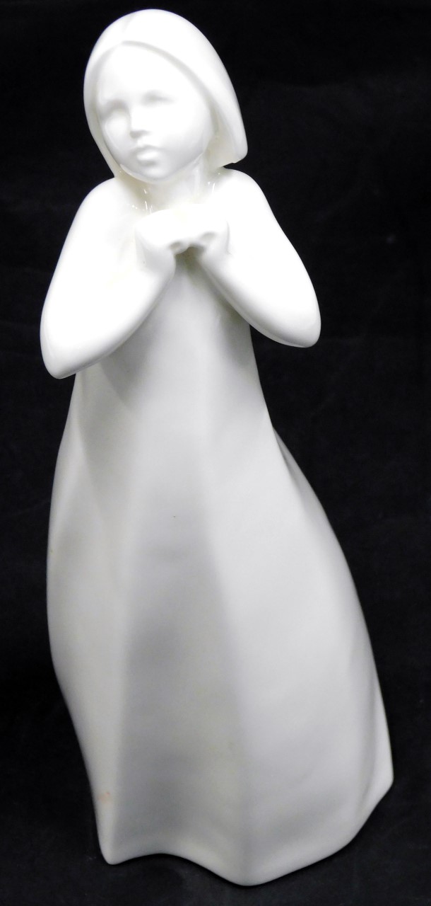 A Royal Doulton porcelain figure from the Images series modelled as Thankful, 24cm high.