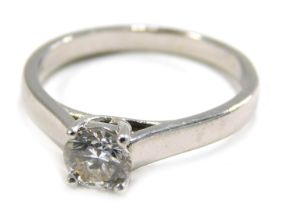 An 18ct white gold diamond solitaire ring, set with round brilliant cut diamond in four claw setting