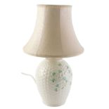 A Belleek porcelain lamp base, with stylised basket work decoration embellished with shamrocks,