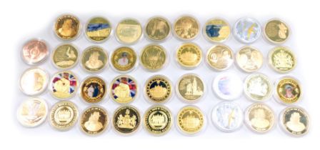 A collection of commemorative coins, for WWI, The Royal Family, Churchill and others, each in presen