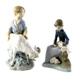 A Nao porcelain figure group, modelled as a young boy beside ram, printed marks, 20cm high, together