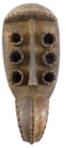 A Grebo (Kru) six eyed spiritual Maou mask, Liberia, approximately 60 years old, 42cm high.