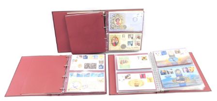 A quantity of coin covers, an album relating to the Royal Family, others from the millennium, etc.