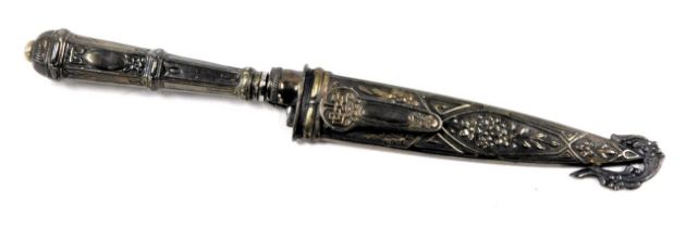 An Oriental ornamental presentation dagger, of hexagonal form with dragons and swags, with Chinese w