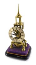 A late 19th/early 20thC brass skeleton clock, with tapering spire, single fusee movement, on ebonise