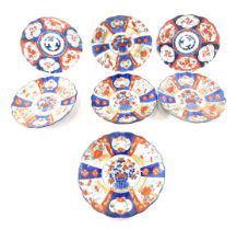 Seven various Meidi period Japanese Imari porcelain dishes, each decorated in typical style with fis