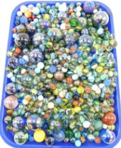 Vintage marbles and a book on marble collecting.