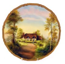 A Royal Worcester porcelain plate, painted with a cottage scene titled Ripple by Michael Ayrton,