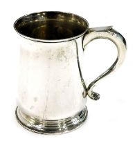 A Ogden's of London and Harrogate pint tankard, with thumb piece, in a plain design with stepped foo