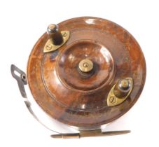 An Albert Smith The Penguin walnut, aluminium and brass fishing reel, 10cm diameter.