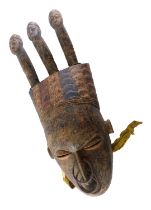 A Koulango large meditation mask with three ancestor heads, Cote D'Ivoire, approximately 85 years ol