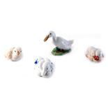 Two pairs of Royal Copenhagen ducklings, one decorated in blue, a duck numbered 1192, and a chick 60