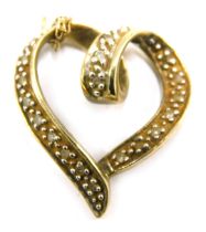 A 9ct gold heart shaped pedant and chain, the pendant set with cz stones, 2cm high, on a fine link n