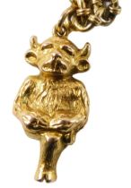 A Lincoln Imp pendant and chain, the yellow metal Lincoln Imp stamped 9ct, 3cm high, on a two row fa