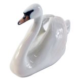 A Royal Copenhagen porcelain swan, numbered 073, 17cm wide.