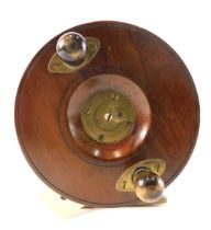 An olivewood and brass fishing reel, with turned horn handles, unmarked, 13cm diameter.
