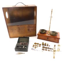 A set of brass chemist or jeweller's scales, in fitted case, 40cm x 37cm overall.