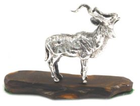 A 20thC white metal figure modelled as a Kudu antelope by Patrick Mavros, stamped to underside 701,