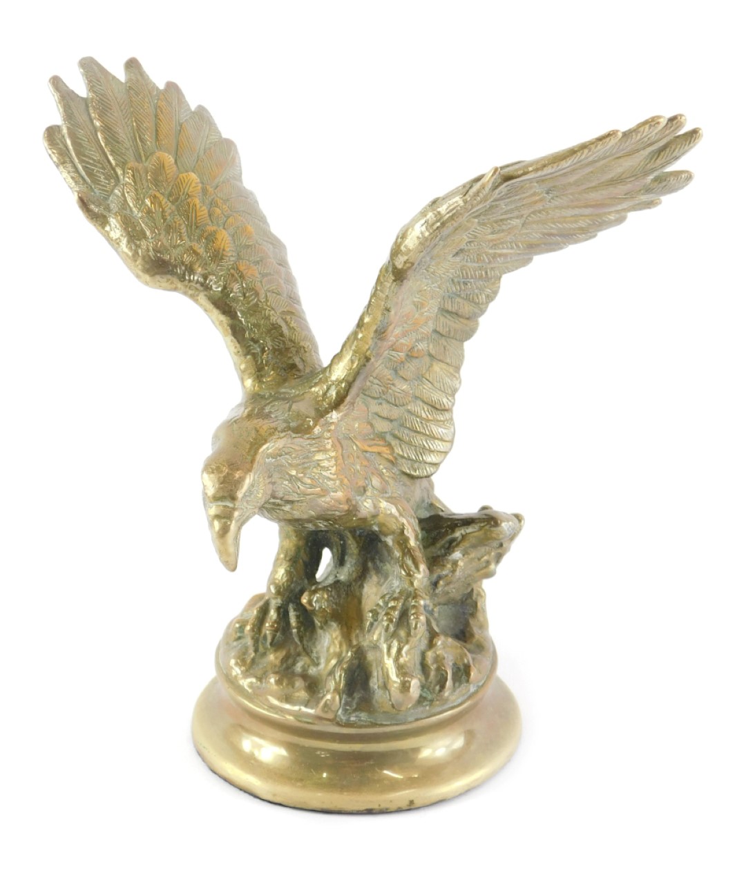 A brass model of an eagle, on a circular base, 25cm high.