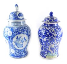 A modern Chinese porcelain vase and cover, decorated in blue with flowering prunus, and a similar bl