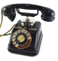 A Scandinavian Kjobenhavns Telefon Bakelite ebonised metal and copper telephone, with register to th
