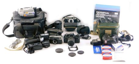 A quantity of camera equipment, to include a Praktica BCA electronic camera with lens, a further Pra