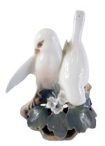 A Royal Copenhagen porcelain figure group of lovebirds, numbered 402 to underside, with a pierced ba