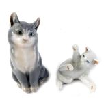 A Royal Copenhagen porcelain seated grey cat, 12cm high, and a white kitten.