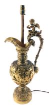 A late 19th/early 20thC Continental gilt metal table lamp, modelled in the form of a ewer decorated