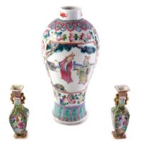 A late 19th/early 20thC Chinese famille rose baluster shaped vase, decorated with figures, 26cm high