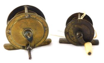 A small brass fishing reel, 5cm diameter, and another similar example with a bone handle.