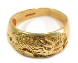 A 9ct gold dress ring, of half hoop design with inset dragon, on a plain band, ring size V, 6.8g.