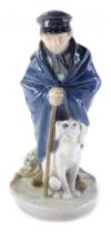 A Royal Copenhagen porcelain figure of a shepherd with dog, numbered 782 by Christian Thomsen, 19cm