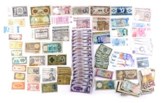 A collection of mixed banknotes, comprising Bank or Ireland, German zen, Portuguese peso, Chinese ba