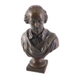 A bronzed spelter bust of William Shakespeare, on a square titled base, 28cm high.