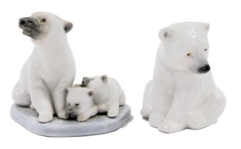 A Lladro porcelain figure group modelled as a seated polar bear beside two cubs, printed marks, 9cm