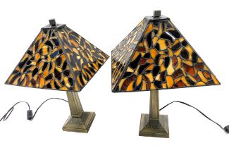 A pair of Tiffany style table lamp, each with a bronze effect base, and a stained glass square shade