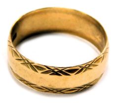 A 9ct gold wedding band, with petallated border, maker S&W, London 1905, ring size U, 3.3g all in.