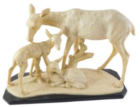 After A Soulier. Figure group of deer and faun, on a rectangular base, resin, 34cm wide.